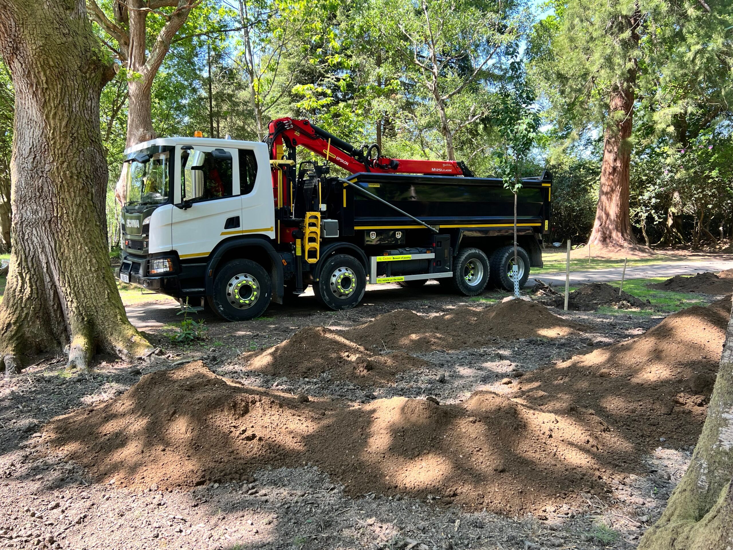 AFD Transport's 8-wheel Scania grab lorry parked on a forest track in Sussex.